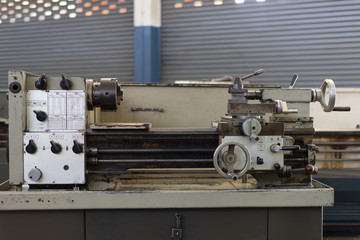 Repair of old metal lathe machine for metalworking closeup in workshop