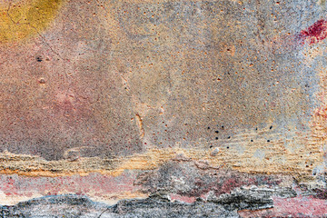 Texture of a concrete wall with cracks and scratches which can be used as a background