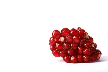 pomegranate seeds on white background.