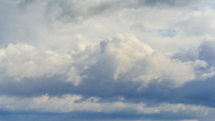 Fototapeta na wymiar Beautiful puffy clouds isolated against blue skies