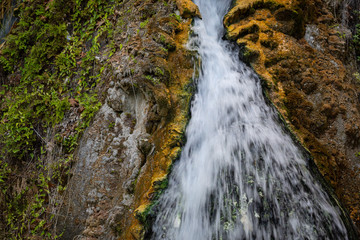 interesting unusual visible on a mountain waterfall on a sunny day for background or screensaver,
