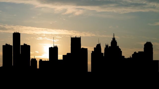 Detroit: Skyline of City with Dark Silhouette of Skyscrapers in Downtown, Time Lapse at Sunrise, Michigan, USA