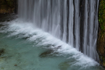 interesting unusual visible on a mountain waterfall on a sunny day for background or screensaver,