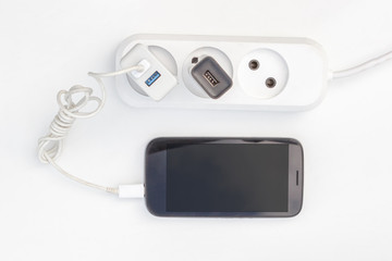 the power supply with the connected charger to phone
