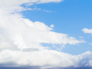 Beautiful puffy clouds isolated against blue skies