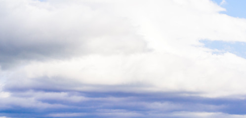 Beautiful puffy clouds isolated against blue skies