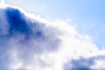 Beautiful puffy clouds isolated against blue skies