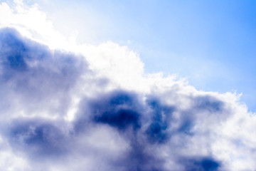 Beautiful puffy clouds isolated against blue skies