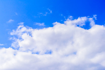 Beautiful puffy clouds isolated against blue skies