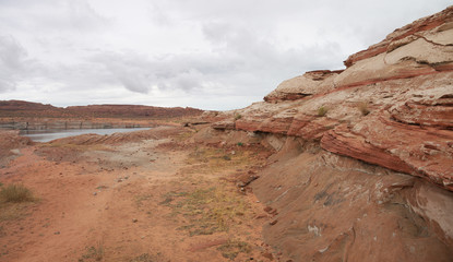 Lake Powell and red rock shore stunning panorama