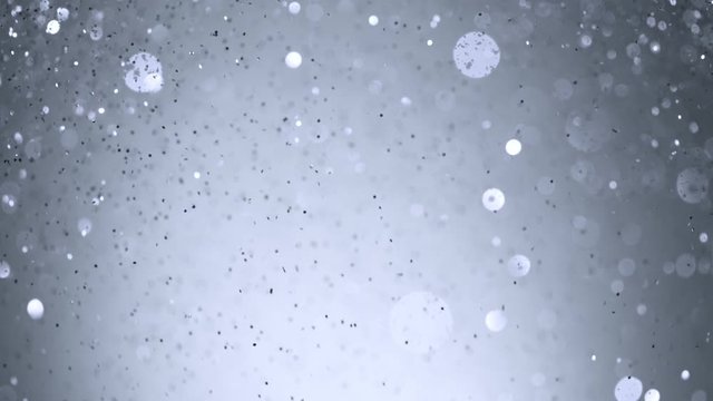 Super Slow Motion Shot of Silver Glitter Background at 1000fps. Shooted with High Speed Cinema Camera in 4K Resolution.