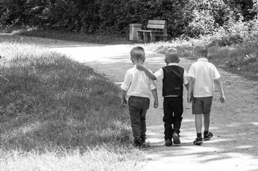 Children go together on the path In Park