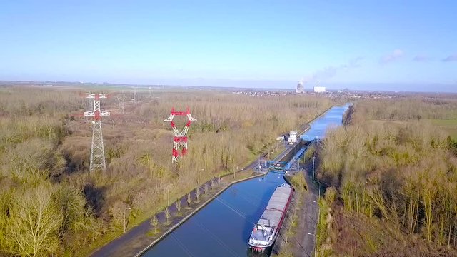 Aerial of Lock of L'Escaut canal, near Bouchain, with Bouchain thermal power station in backgroundHauts-de-France, France