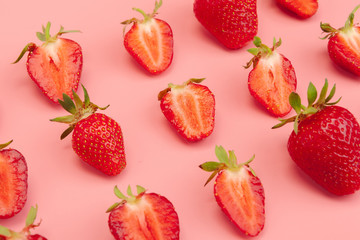 Strawberries on pink background. Fresh organic food concept