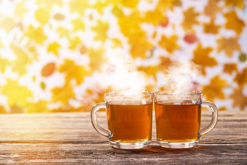 Couple cups of black tea on wooden table,with copy space.