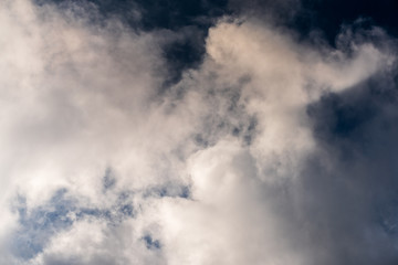 Beautiful puffy clouds isolated against blue skies