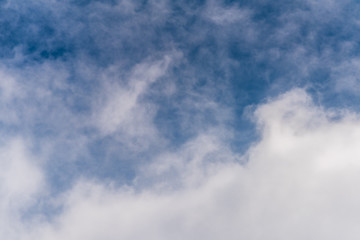 Beautiful puffy clouds isolated against blue skies