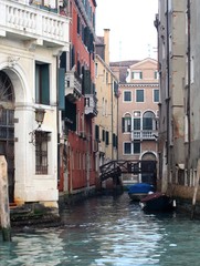 Fototapeta na wymiar Venice, Italy, December 28, 2018 evocative image of the foreshortening of a canal with a bridge connecting houses