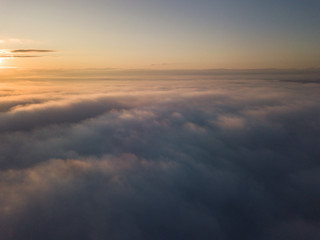View above clouds during sunrise. Dramatic view the sky.
