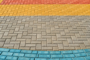 yellow, red and blue paving tiles for background or texture