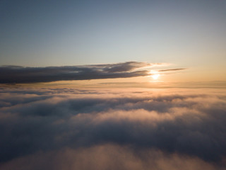 View above clouds during sunrise. Dramatic view the sky.