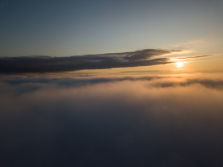 Obraz premium View above clouds during sunrise. Dramatic view the sky.