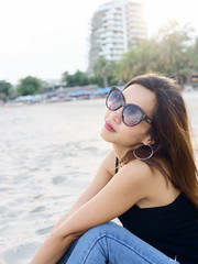 Asian woman relaxing on the beach, lifestyle concept.