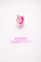 Christmas background on a light background with a Christmas toy and text - Merry Christmas and Happy New Year.