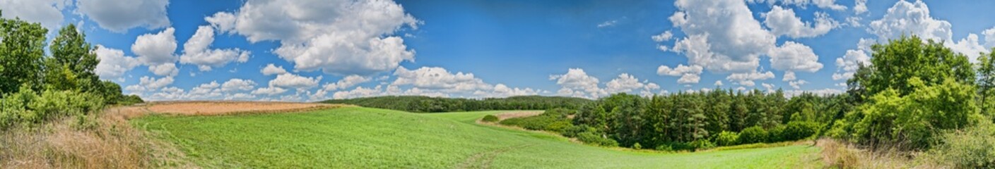 hdr landscape panorama in spring with clouds and blue sky