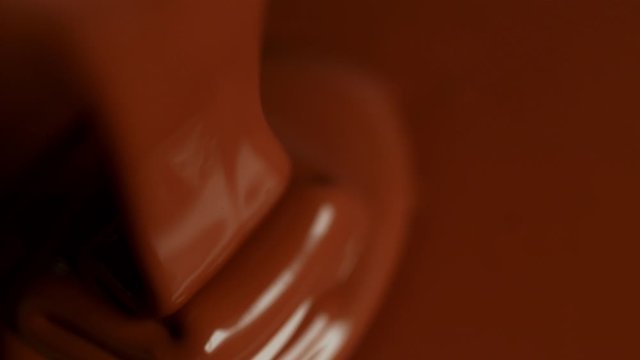 Super Slow Motion Shot of Pouring Meldet Chocolate at 1000fps. Shooted with High Speed Cinema Camera.