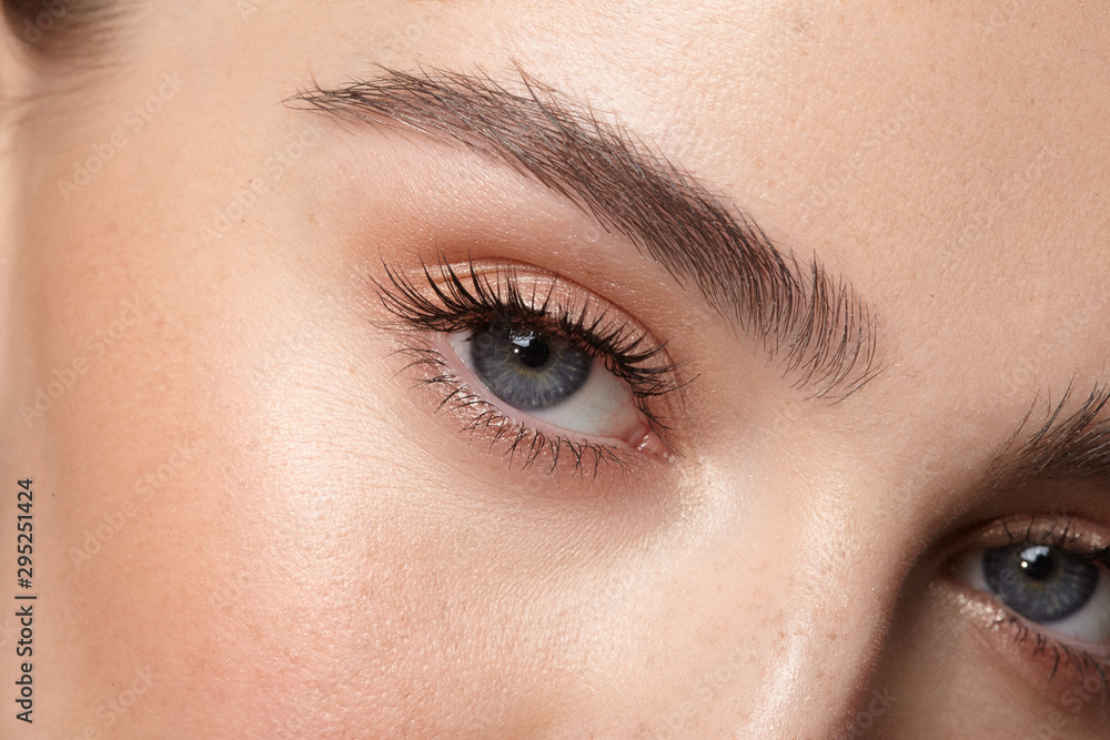 Natural makeup eyes and brows close-up (Adobe Stock comp)