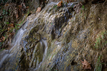 interesting unusual visible on a mountain waterfall on a sunny day for background or screensaver,