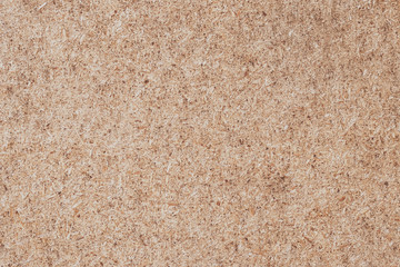 Plywood background. Cork texture, wood panel, chipboard. Desk surface. Natural color.