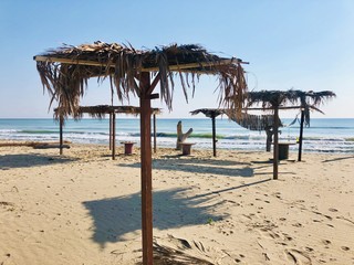 beach with chairs and umbrellas