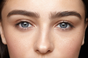 girl with nude make-up with blue eyes closeup - Powered by Adobe