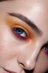 Obraz premium close-up of a young girl with colored makeup
