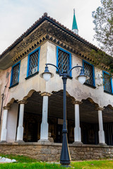 Bayrakli Mosque or Yokush Mosque in Samokov, Bulgaria, exterior partial view with a street lamp