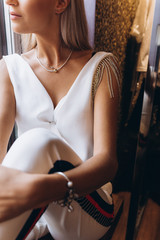 Young girl model sitting near the window in luxury style. Fashion. modeling concept