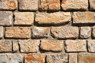 Vintage grunge sandstone blocks wall texture.