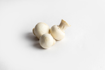 fresh champignon mushrooms on a white background