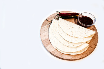 Delicious tortillas on kitchen table
