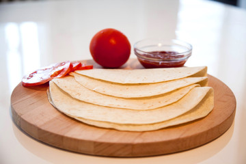 Delicious tortillas on kitchen table