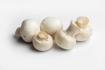 fresh champignon mushrooms on a white background