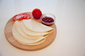 Delicious tortillas on kitchen table