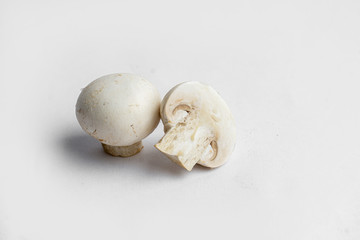 fresh champignon mushrooms on a white background