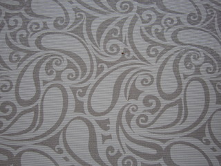 Gray and white ornament on a cotton canvas