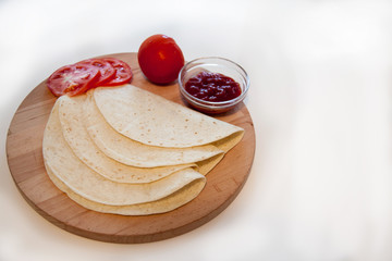 Delicious tortillas on kitchen table
