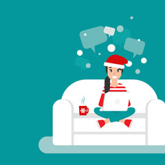 Happy freelancer girl on sofa with computer, santa hat and speech bubbles on sofa.