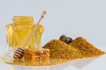 Honey with fruits in a glass jar 