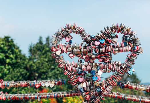 A raw full of love lockers with heart shape hanging on a Malasyan iconic spots